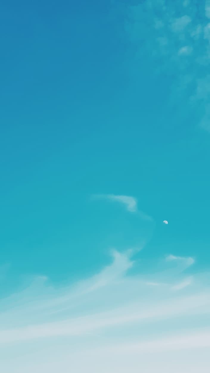 Soft turquoise sky with a small crescent moon and wisps of cloud — calm visual backdrop for the supplement guidance preview